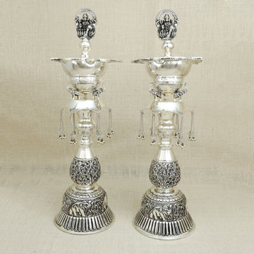 Handcrafted Silver Lakshmi Deepam Set – Ornate Standing Oil Lamps (Set of 2)