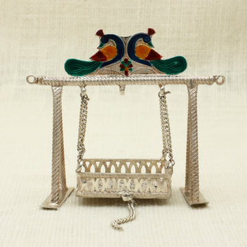 Antique Finish Silver Jhoola – Handcrafted Cradle with Enamelled Peacock Motif