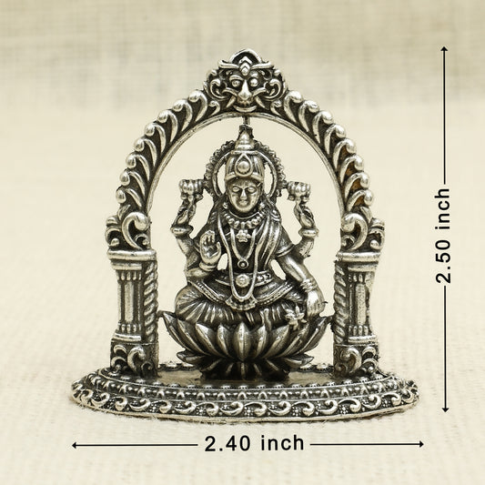 Antique Finish Silver Lakshmi Idol – Seated on Lotus with Arch Frame