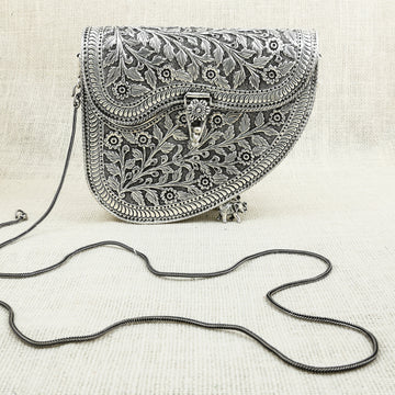 Handcrafted Silver Half-Moon Sling Bag with Floral Engravings