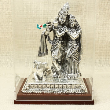 Resin Silver Radha-Krishna Idol with Cow – Graceful Temple Design in Glass Display Case